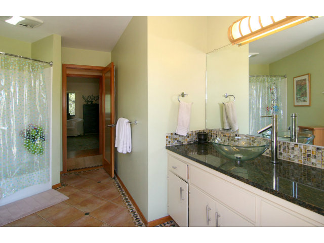455 Poppy Hill Road Watsonville, CA 95076 - Photo 18 of 25 a bathroom with a sink and mirror