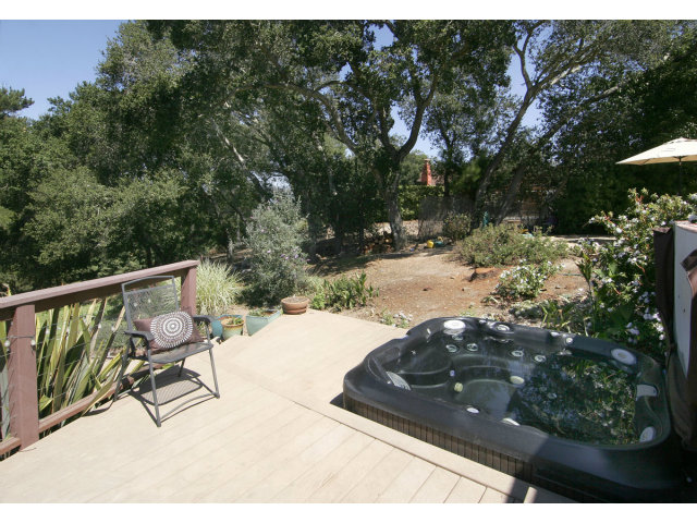 455 Poppy Hill Road Watsonville, CA 95076 - Photo 19 of 25 a view of a backyard with sitting area