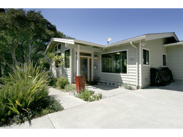 455 Poppy Hill Road Watsonville, CA 95076 - Photo 2 of 25 a front view of a house with a yard and potted plants