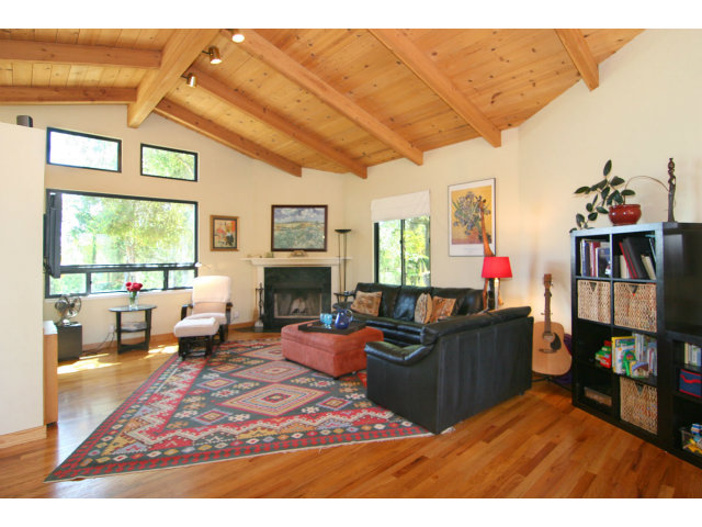 455 Poppy Hill Road Watsonville, CA 95076 - Photo 3 of 25 a living room with furniture a window and a flat screen tv