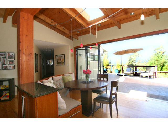 455 Poppy Hill Road Watsonville, CA 95076 - Photo 10 of 25 a dining room with furniture and a floor to ceiling window