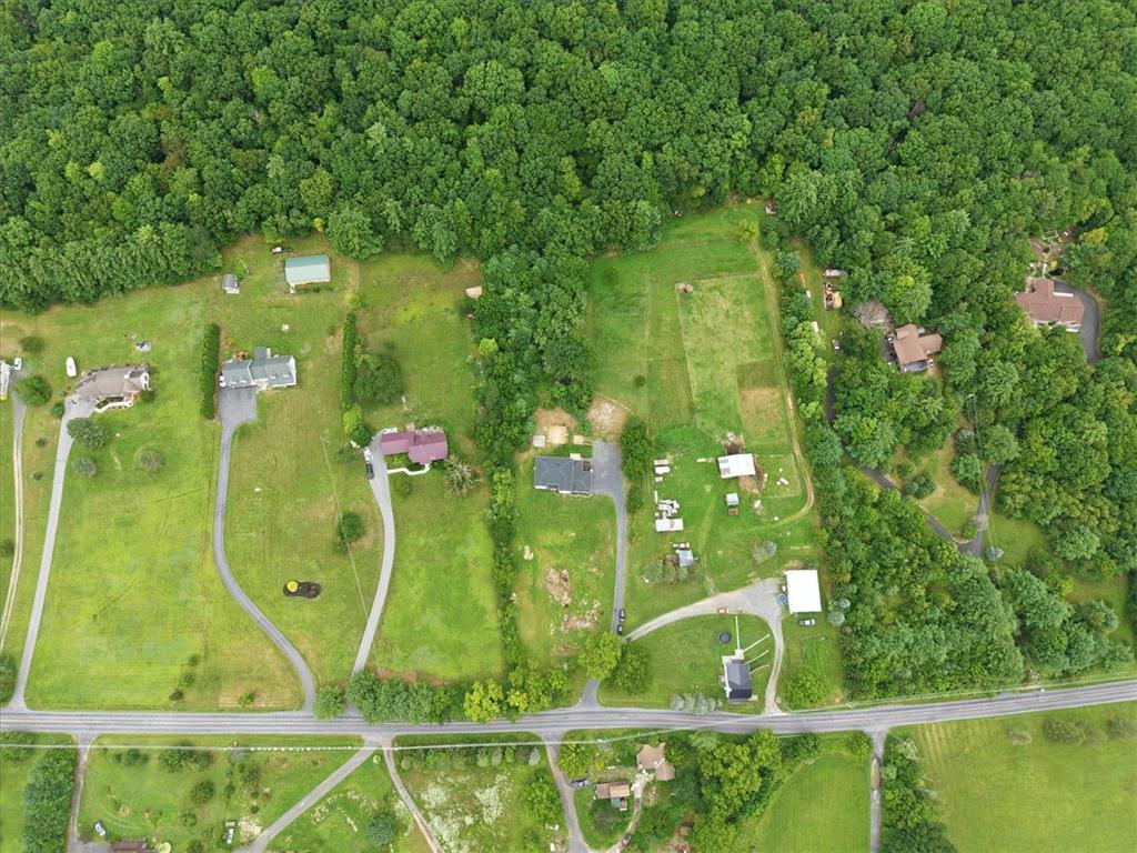 387 Blue Ridge Road Saylorsburg, PA 18353 - Photo 89 of 90 An aerial perspective reveals sprawling green lots bordered by dense woodlands, offering peaceful rural living.