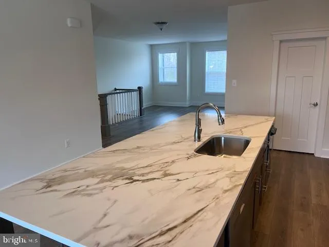 a kitchen with a stove and a sink