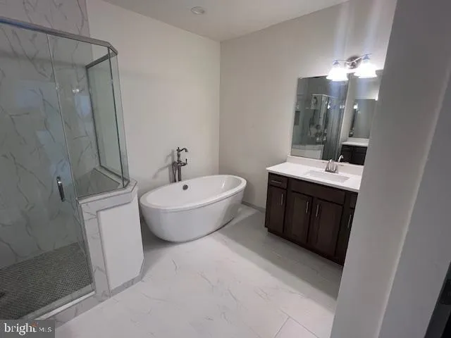 a spacious bathroom with a toilet sink and mirror
