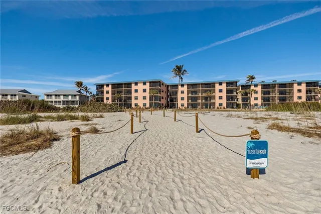 a view of a swimming pool with a lawn chairs