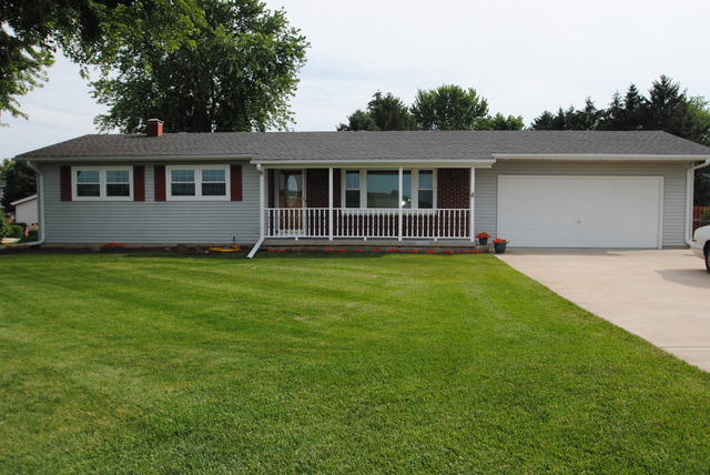 17676 Frazier Road Sandwich, IL 60548 - Photo 1 of 25 a front view of a house with a yard and trees