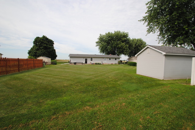 17676 Frazier Road Sandwich, IL 60548 - Photo 24 of 25 a view of a backyard with plants and lake view
