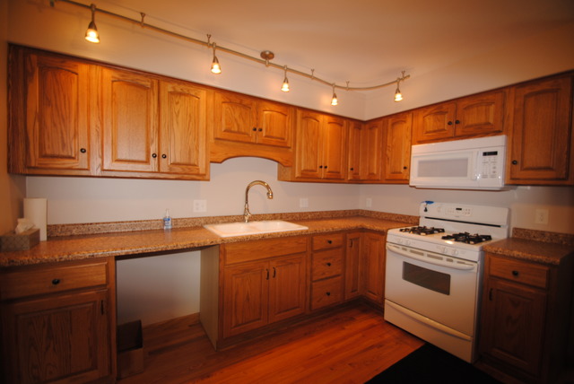 17676 Frazier Road Sandwich, IL 60548 - Photo 5 of 25 a kitchen with stainless steel appliances granite countertop a sink a stove and cabinets