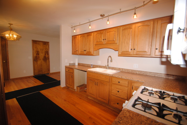 17676 Frazier Road Sandwich, IL 60548 - Photo 7 of 25 a kitchen with sink cabinets and stove