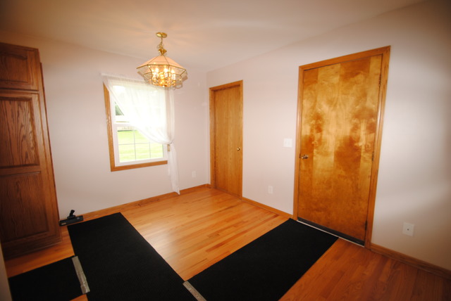17676 Frazier Road Sandwich, IL 60548 - Photo 8 of 25 wooden floor in an empty room with a window