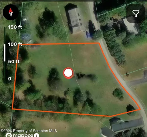 an aerial view of a residential houses with outdoor space