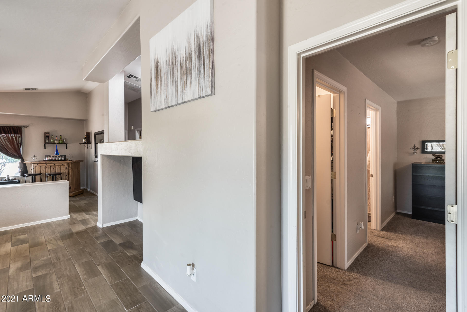 15037 West Calavar Road Surprise, AZ 85379 - Photo 23 of 28 a view of a kitchen from the hallway