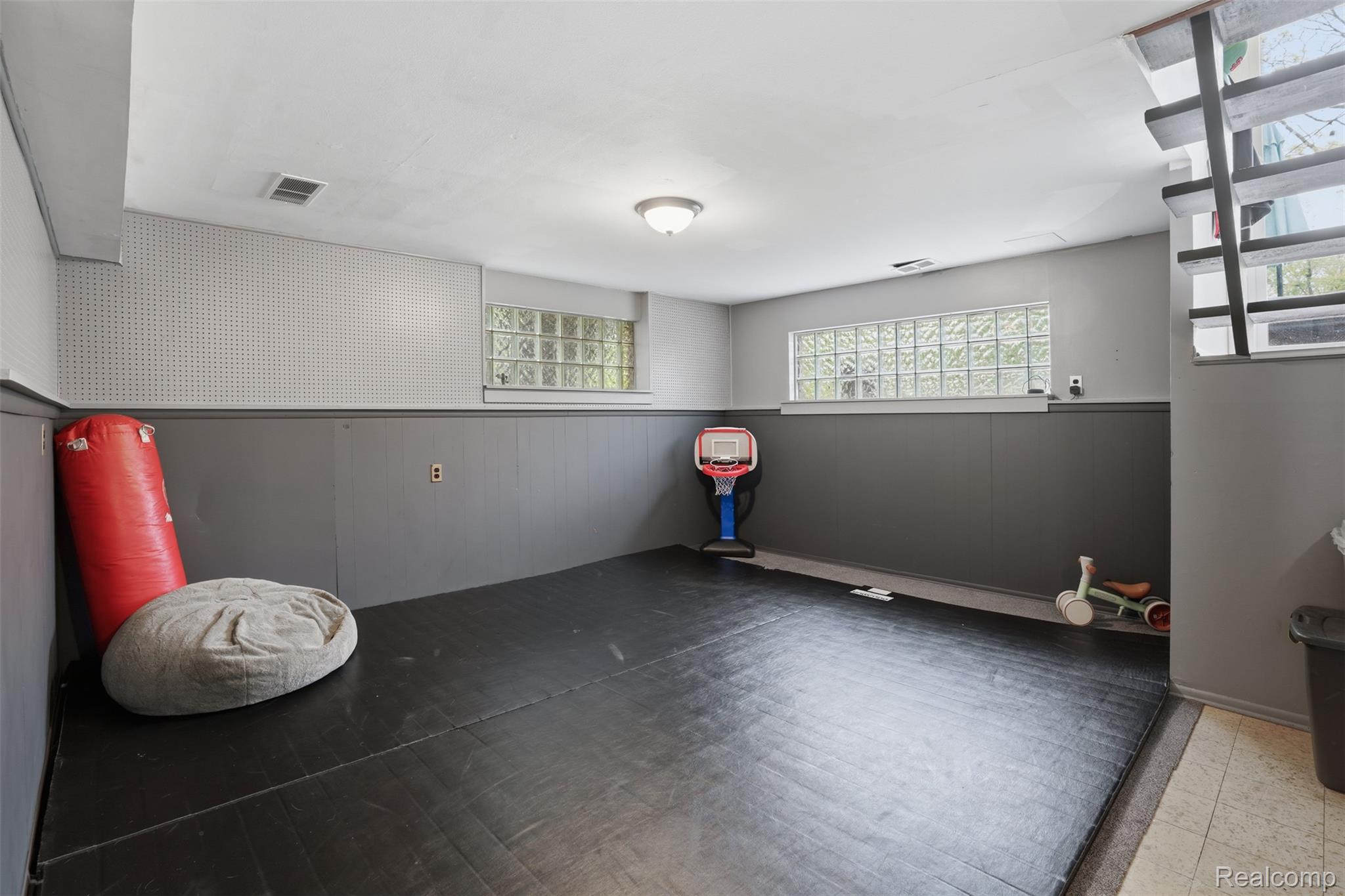 47129 Dunsany Road Northville, MI 48167 - Photo 28 of 49 Spare room with wooden walls and a wainscoted wall