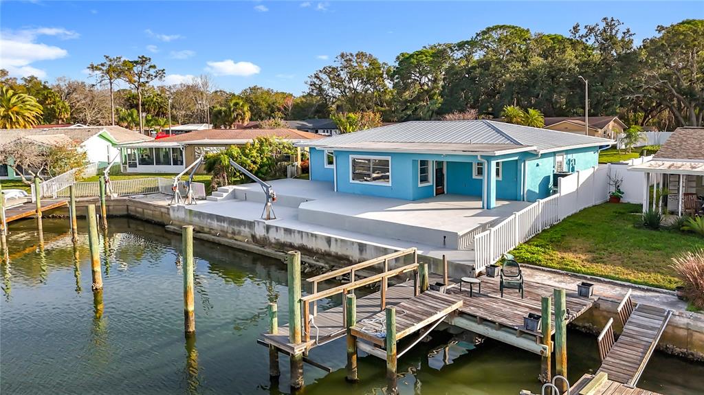 4869 Shell Stream Boulevard New Port Richey, FL 34652 - Photo 12 of 46 a view of a house with pool and chairs
