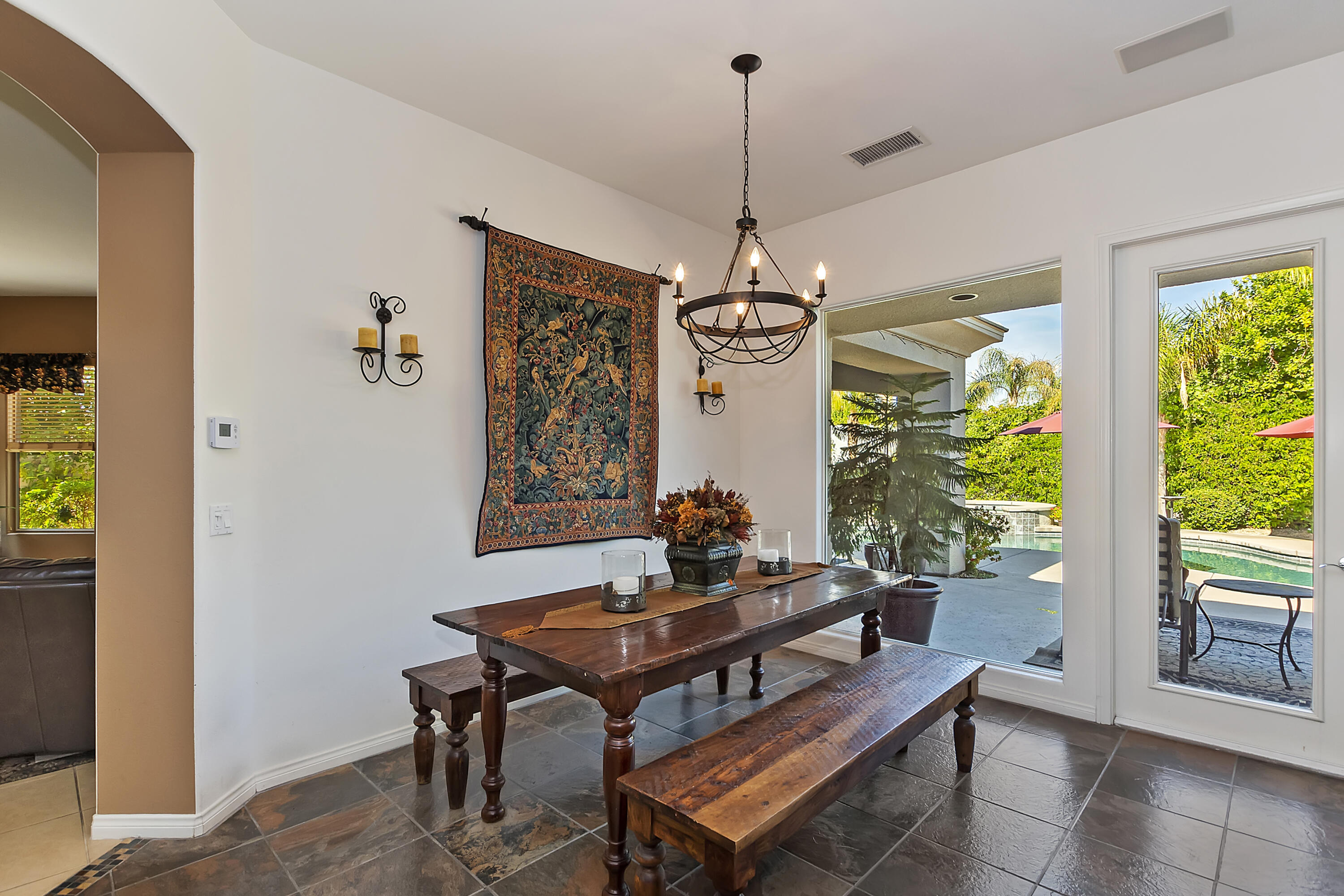 60 Victor Hugo Road Rancho Mirage, CA 92270 - Photo 11 of 44 a view of a dining room with furniture window and outside view