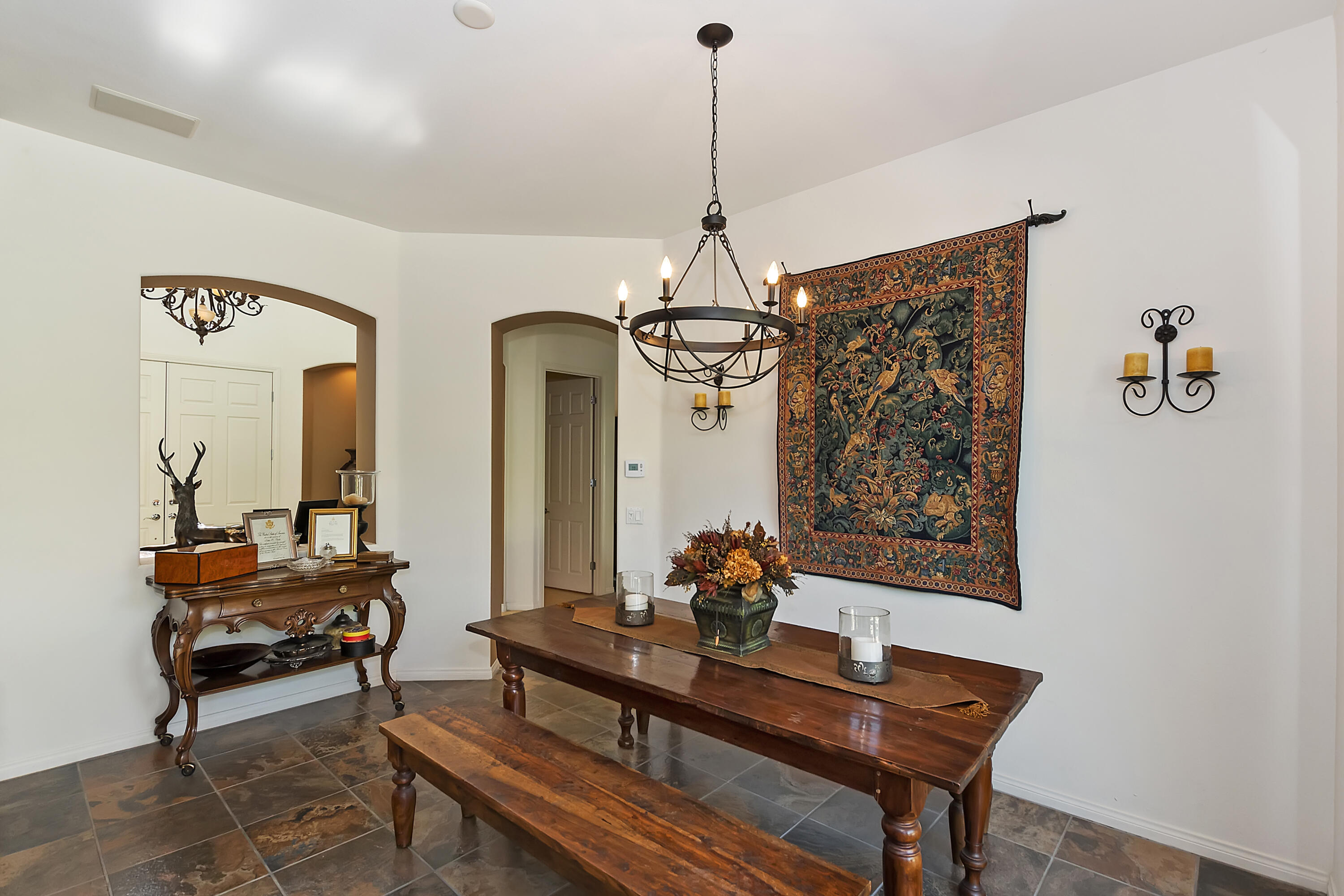 60 Victor Hugo Road Rancho Mirage, CA 92270 - Photo 12 of 44 a living room with furniture and a chandelier