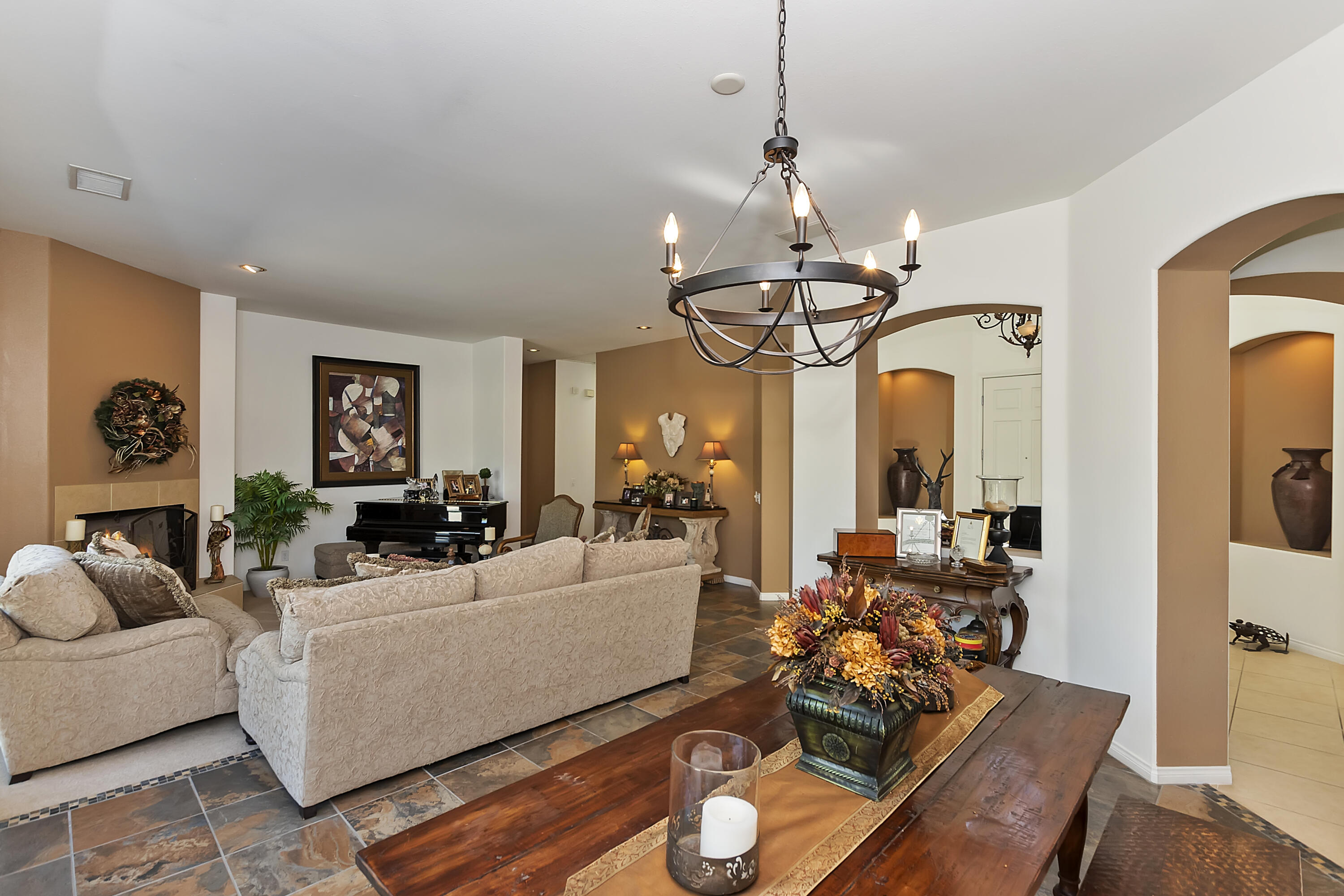 60 Victor Hugo Road Rancho Mirage, CA 92270 - Photo 13 of 44 a living room with patio bathtub and a chandelier