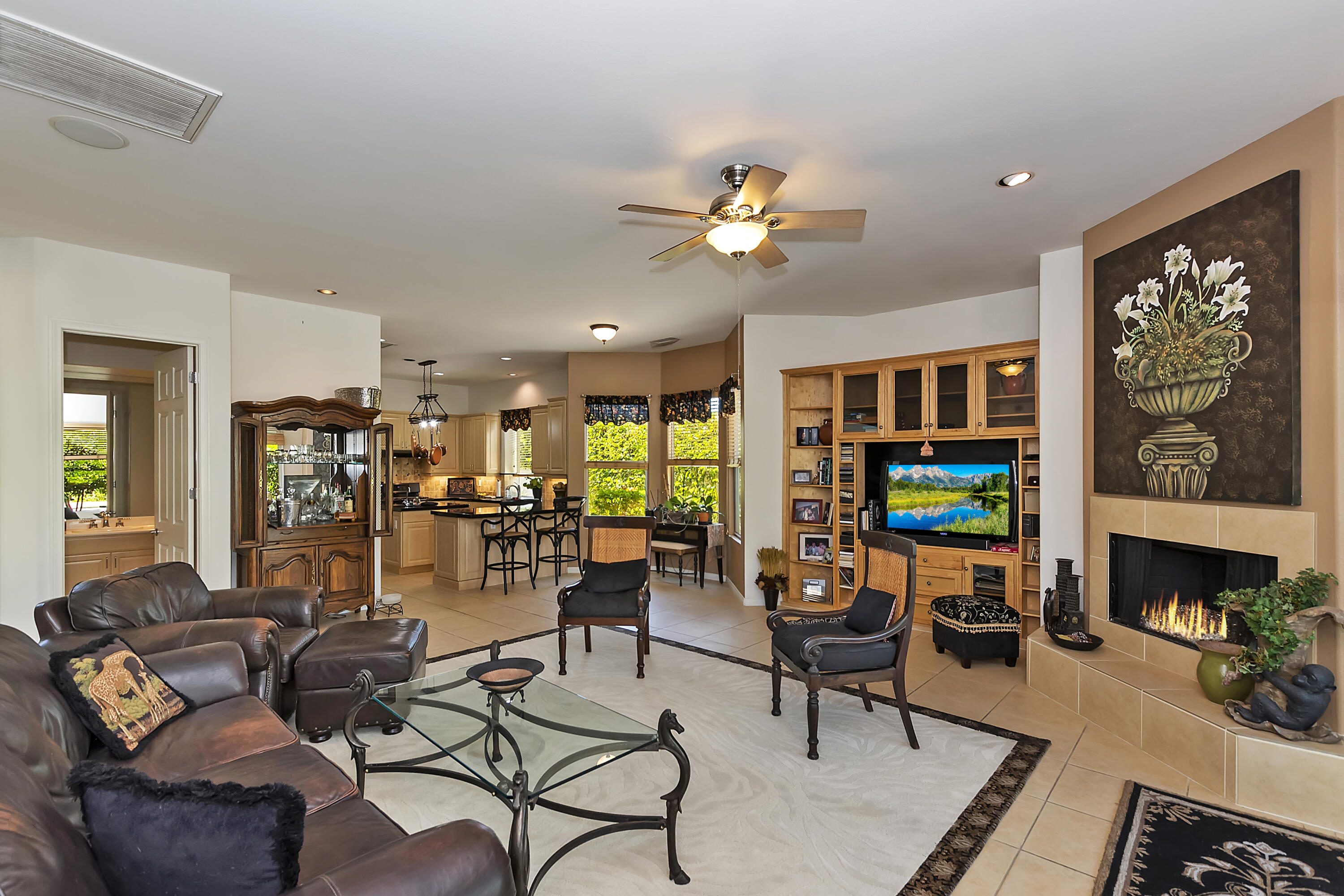 60 Victor Hugo Road Rancho Mirage, CA 92270 - Photo 17 of 44 a living room with fireplace furniture and a flat screen tv