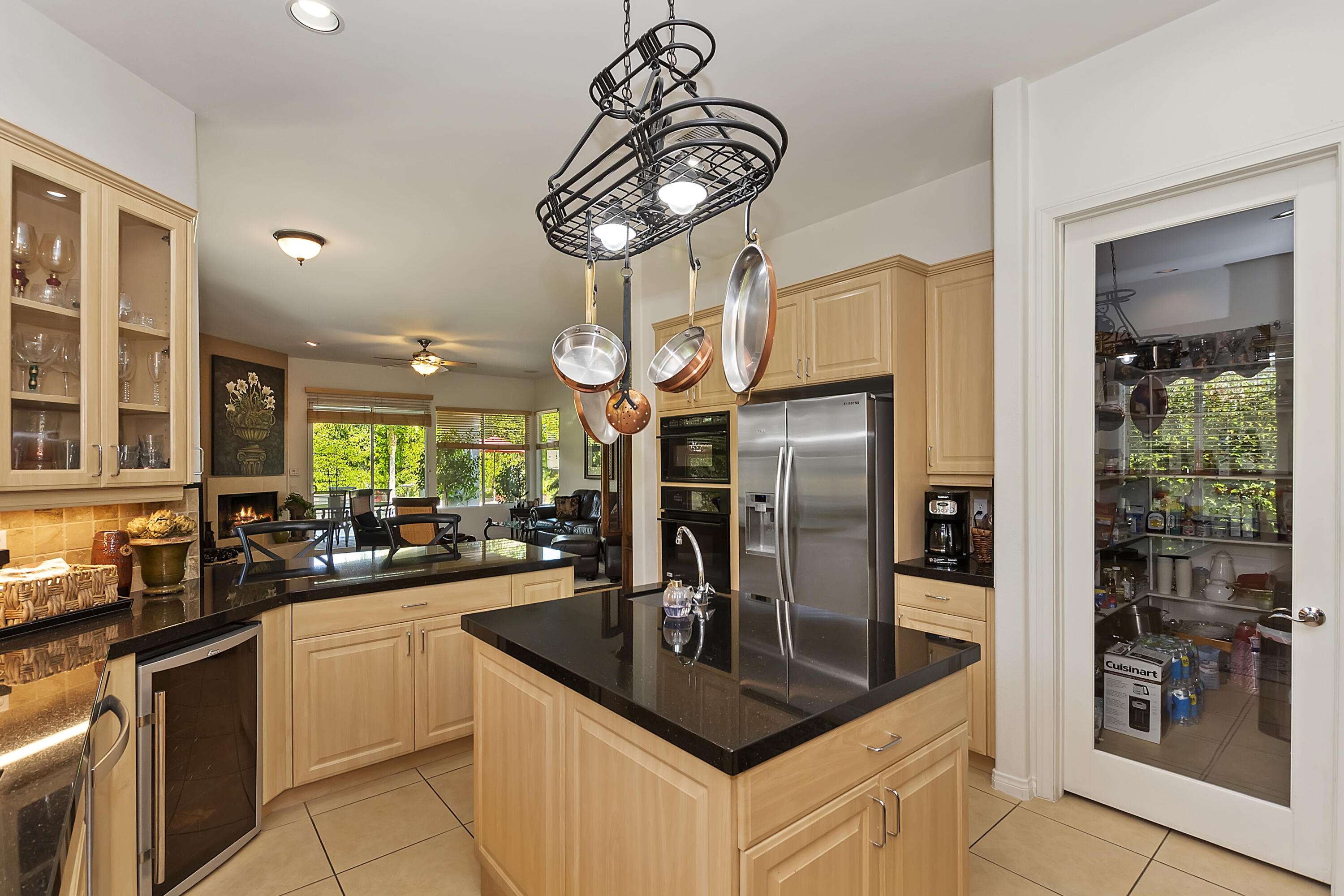 60 Victor Hugo Road Rancho Mirage, CA 92270 - Photo 21 of 44 a kitchen with stainless steel appliances granite countertop a sink a stove and refrigerator