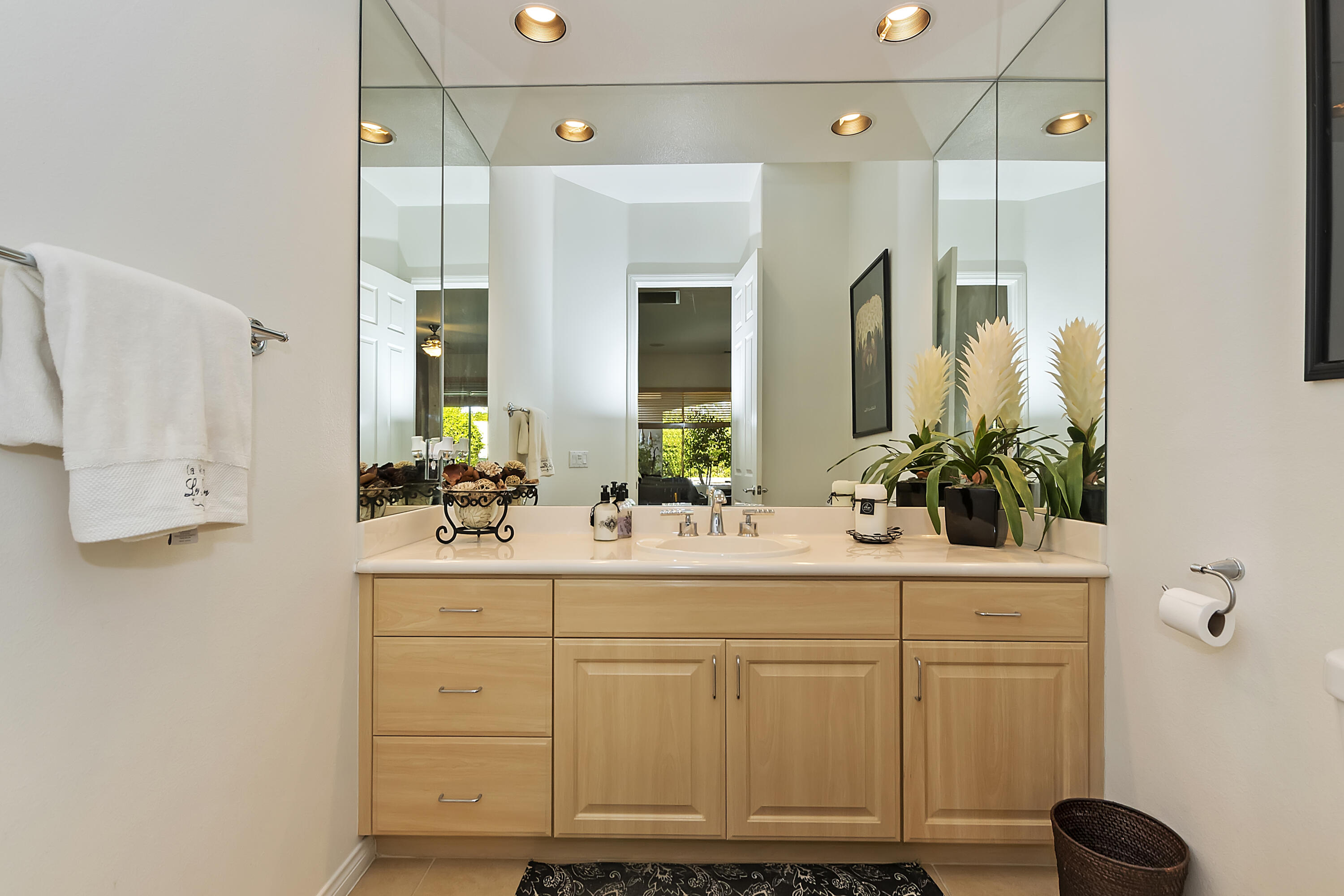 60 Victor Hugo Road Rancho Mirage, CA 92270 - Photo 23 of 44 a bathroom with a sink a potted plant and a mirror