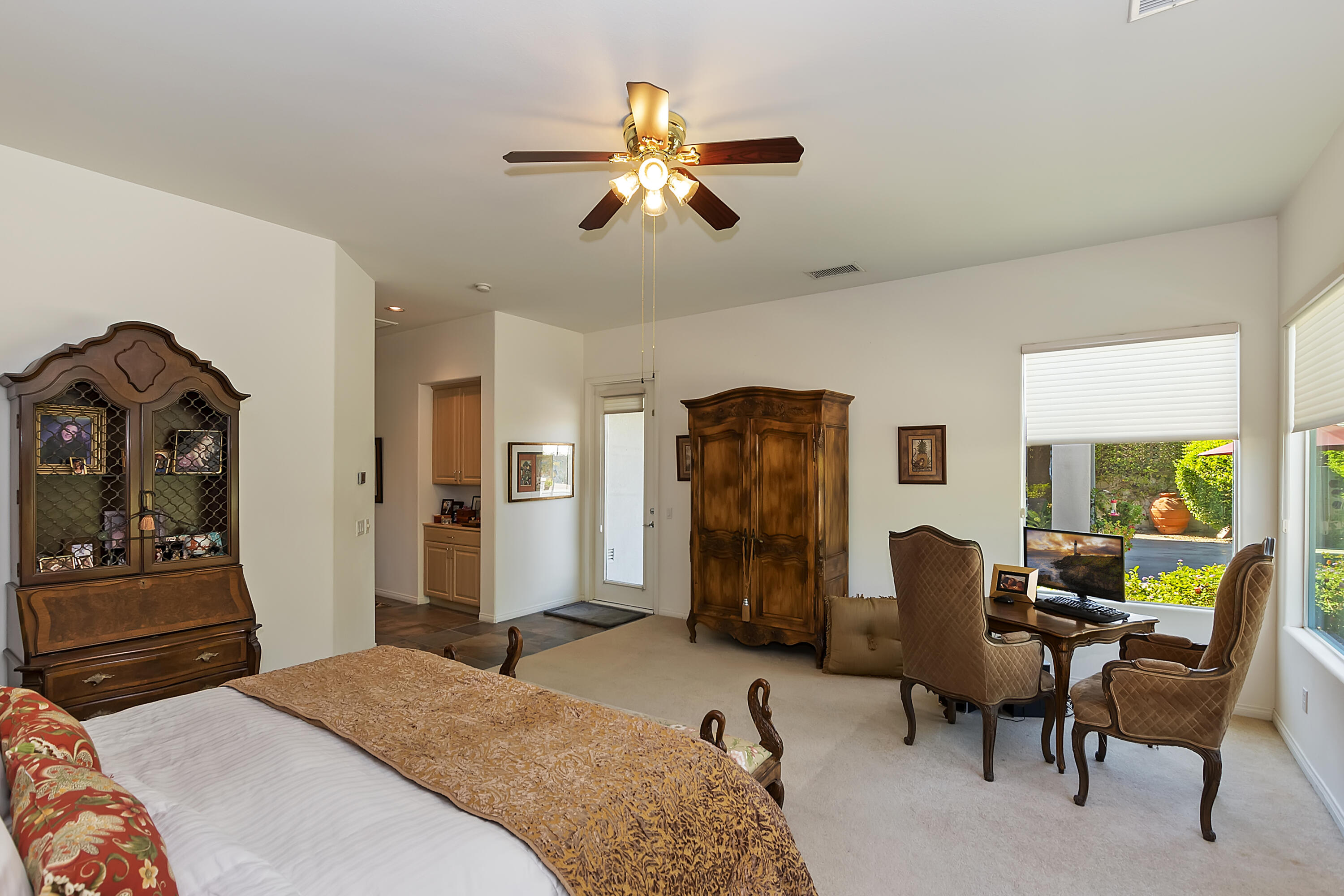 60 Victor Hugo Road Rancho Mirage, CA 92270 - Photo 26 of 44 a bedroom with a bed and workspace