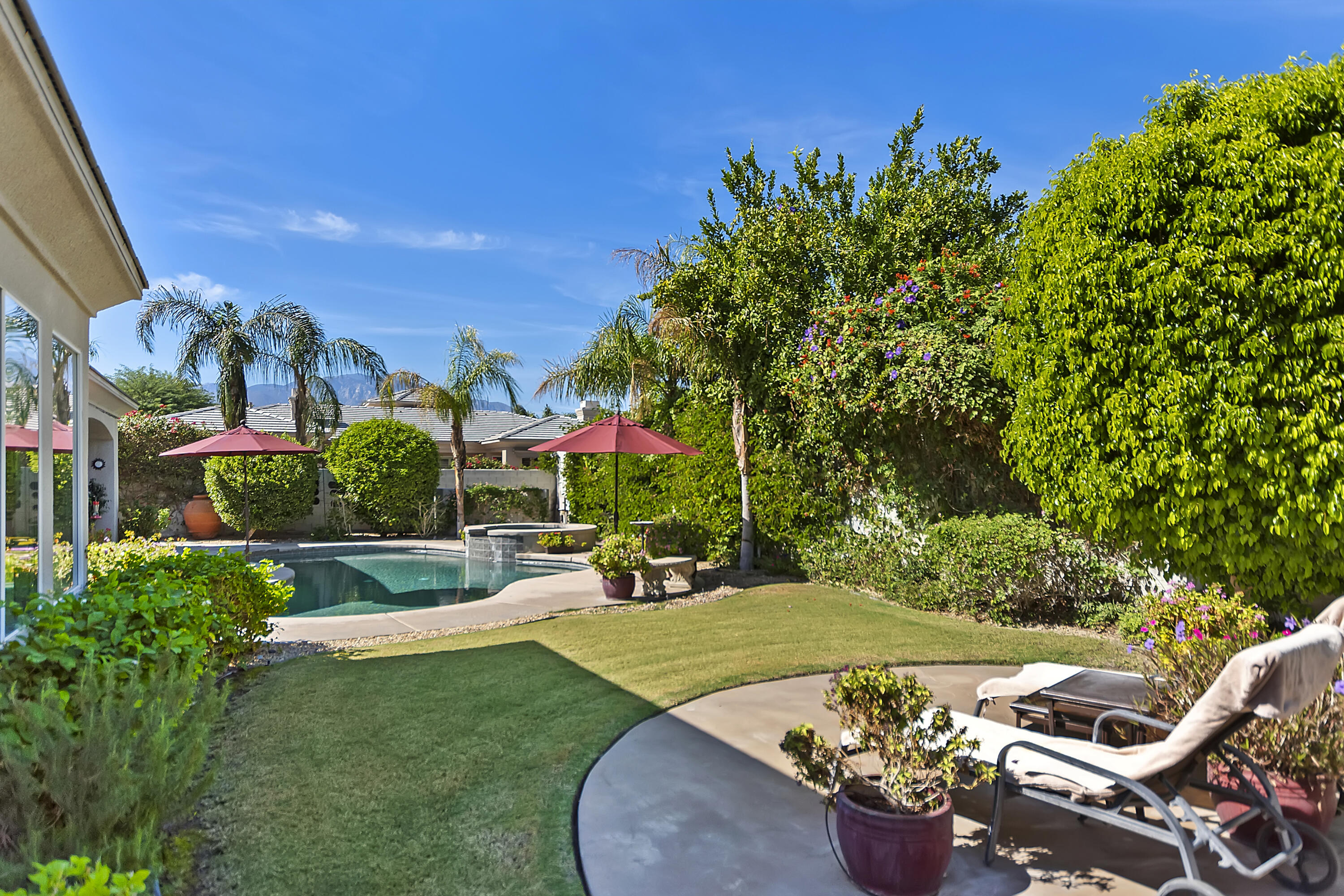 60 Victor Hugo Road Rancho Mirage, CA 92270 - Photo 42 of 44 a view of a garden with patio