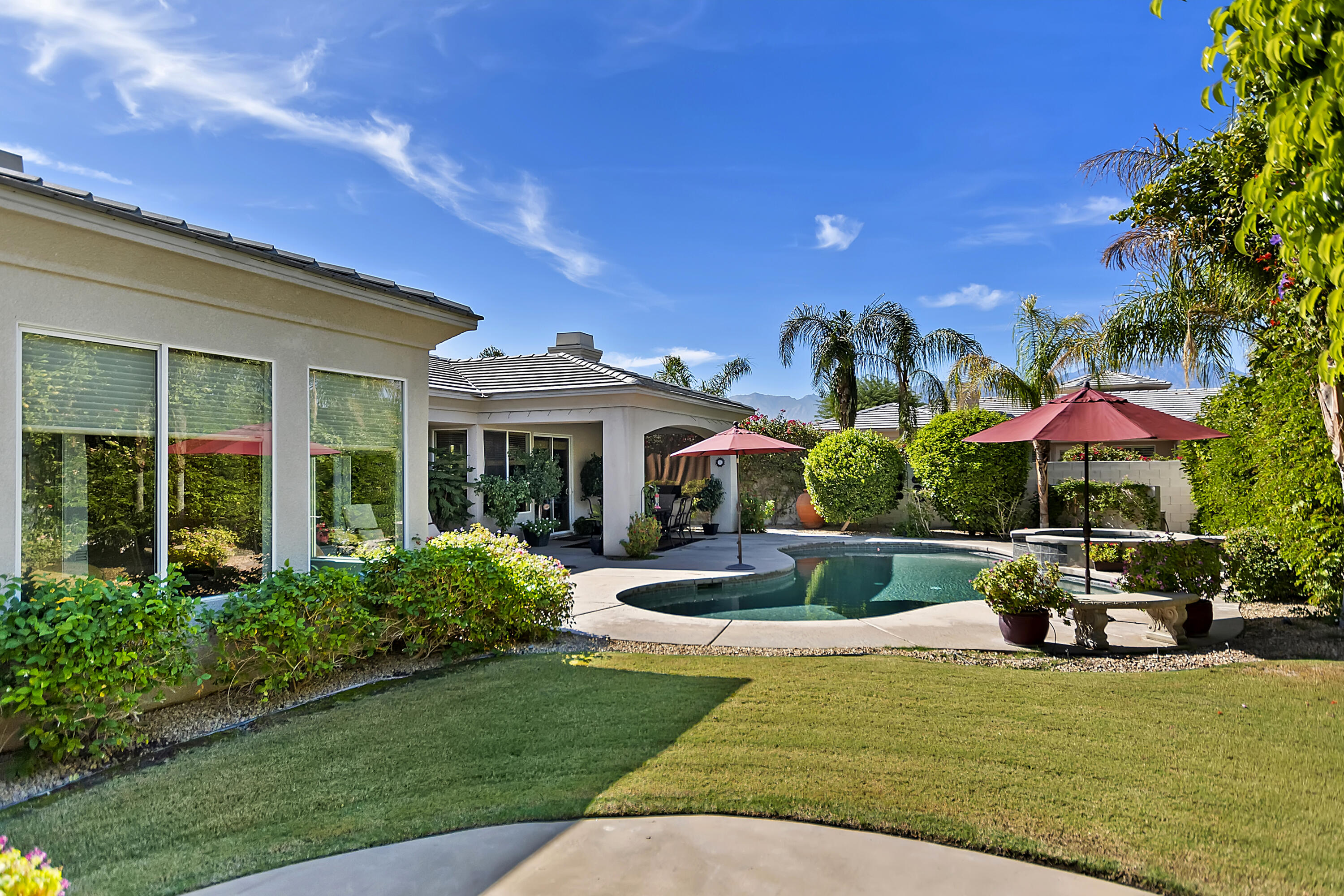 60 Victor Hugo Road Rancho Mirage, CA 92270 - Photo 43 of 44 a view of a house with backyard garden and swimming pool