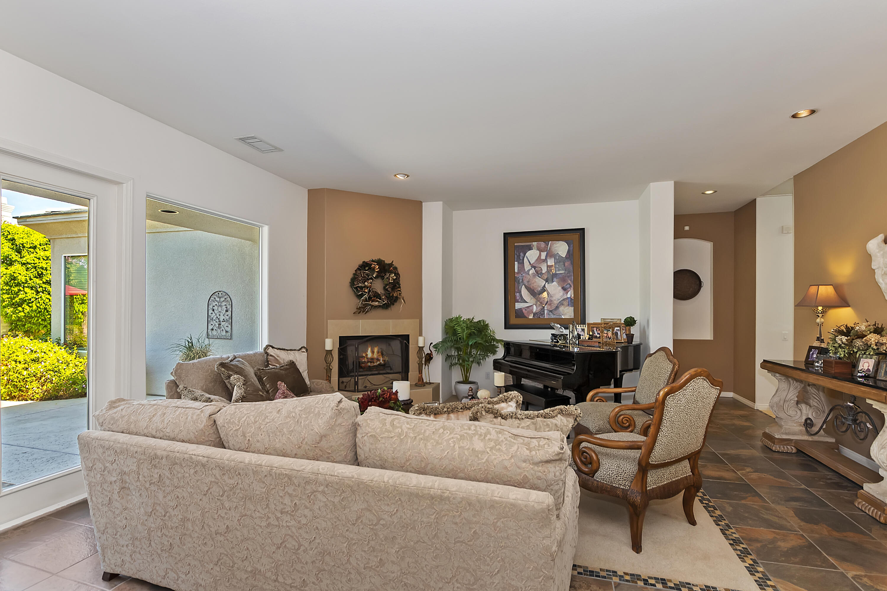 60 Victor Hugo Road Rancho Mirage, CA 92270 - Photo 8 of 44 a living room with furniture and a large window