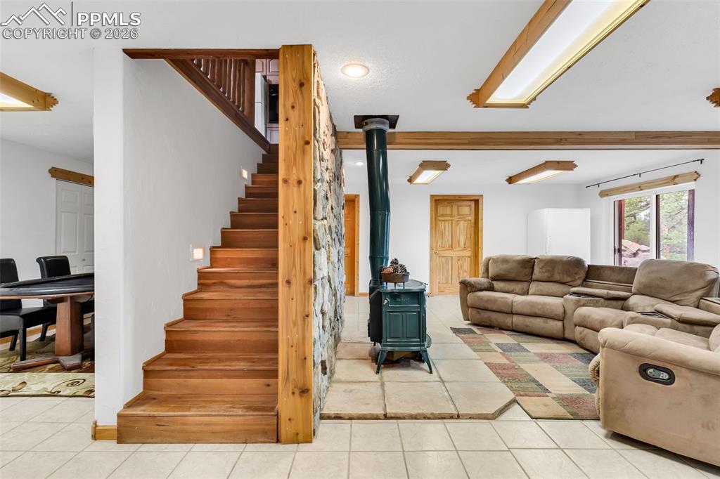 209 Rosewood Road Westcliffe, CO 81252 - Photo 30 of 49 The stairs separate the lower level game area (with tons of closet space) and the den / family room