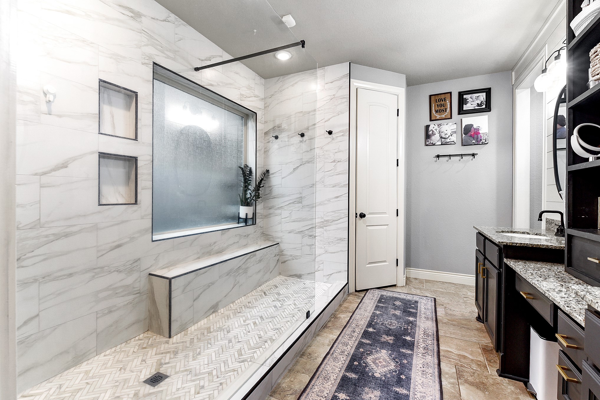 2939 Bobby Jones Road Katy, TX 77494 - Photo 25 of 50 a bathroom with a granite countertop sink a mirror and shower