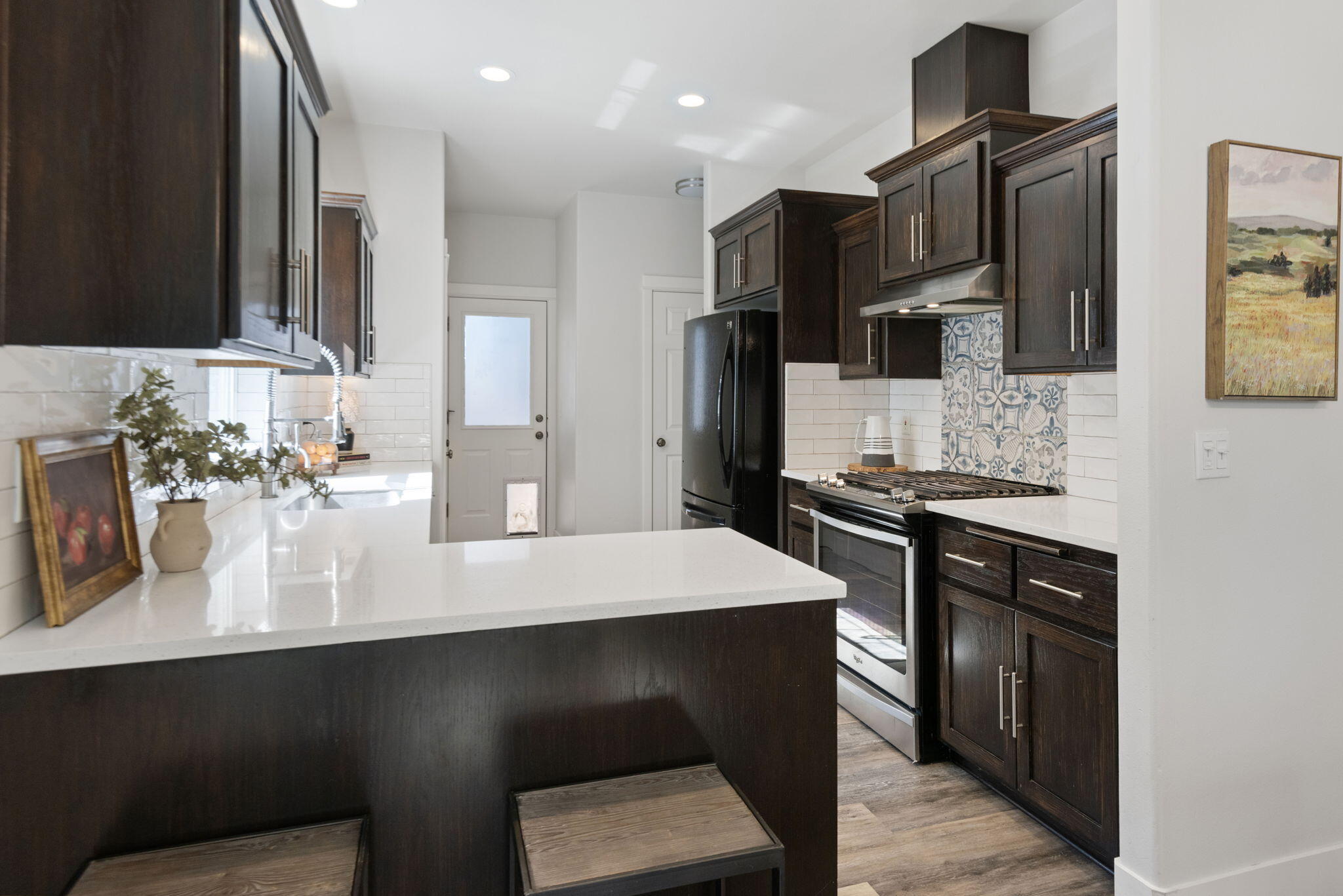 62744 Larkview Road Bend, OR 97701 - Photo 10 of 25 a kitchen with stainless steel appliances a sink and stove