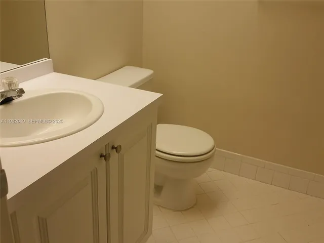 a bathroom with a toilet and a sink