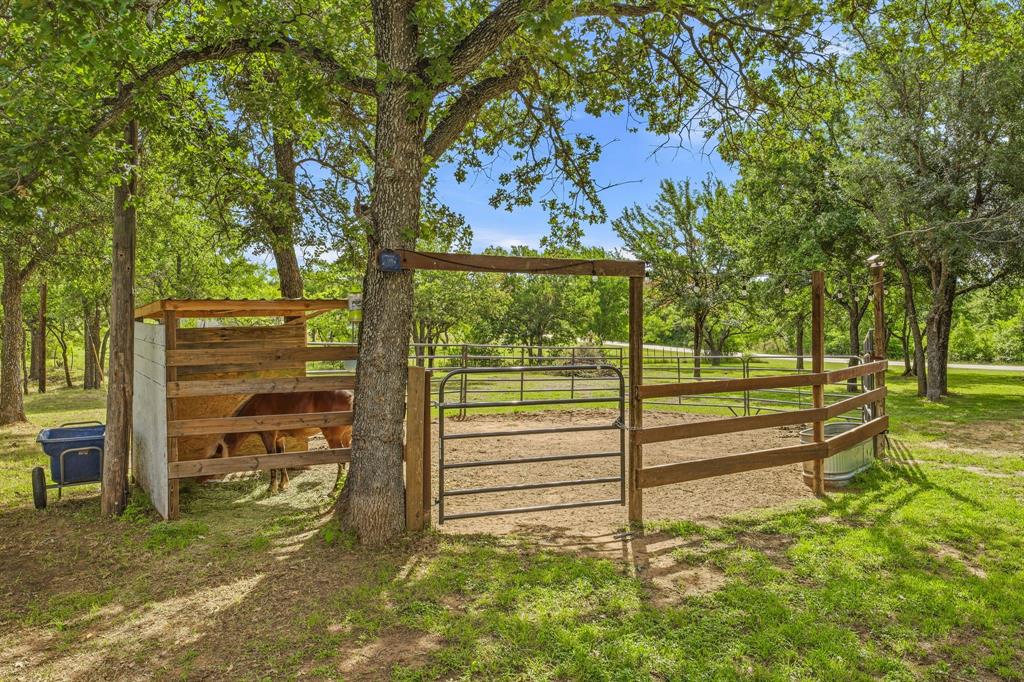 151 High Point Road Weatherford, TX 76088 - Photo 35 of 40 a view of a garden with a bench