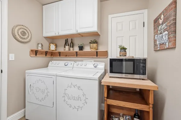 a utility room with dryer and washer