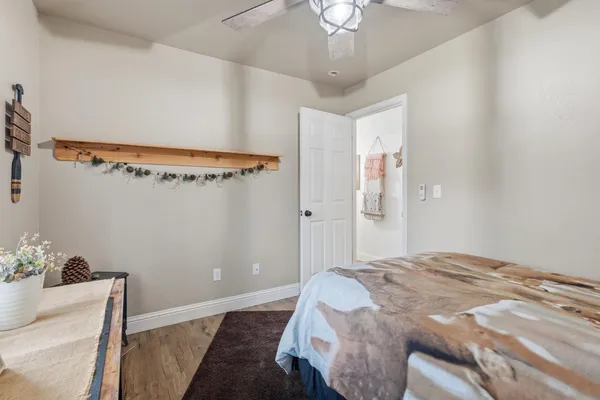 a bedroom with a bed and a chandelier