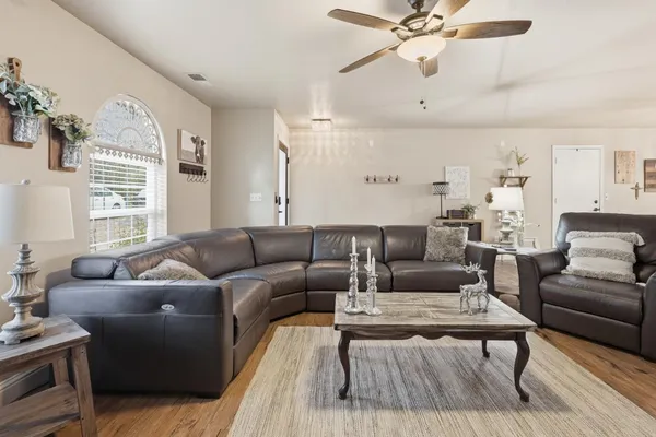 a living room with furniture and a large window