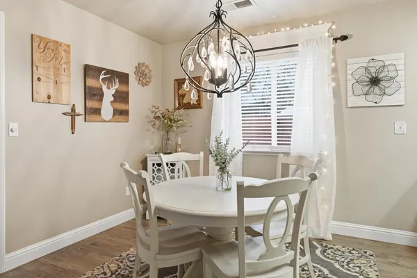 a view of a dining room with furniture and window