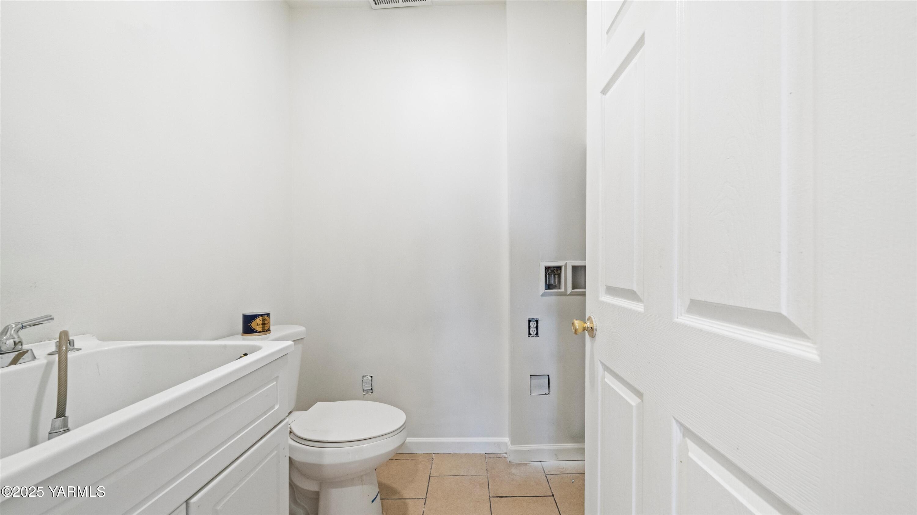 1423 Progressive Road Wapato, WA 98951 - Photo 15 of 24 a bathroom with a toilet and a sink