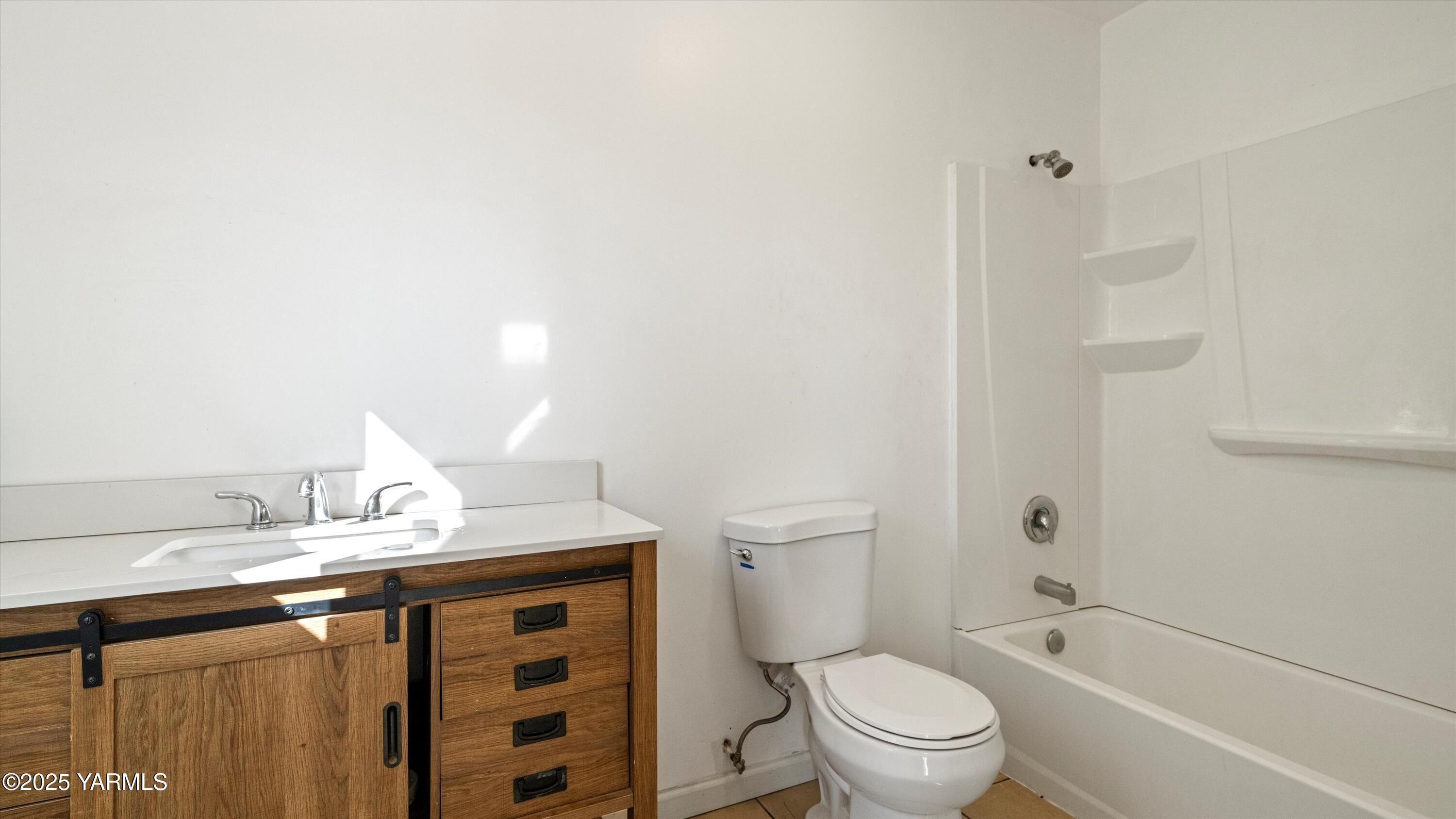 1423 Progressive Road Wapato, WA 98951 - Photo 6 of 24 a bathroom with a sink a toilet and shower