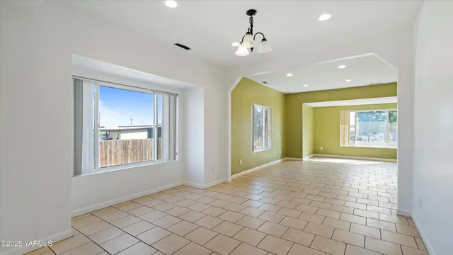 a view of a kitchen with a sink and a window
