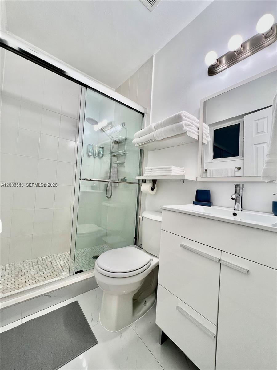 1380 Southwest 11th Street, Unit 1 Miami, FL 33135 - Photo 12 of 20 a bathroom with a sink toilet and shower
