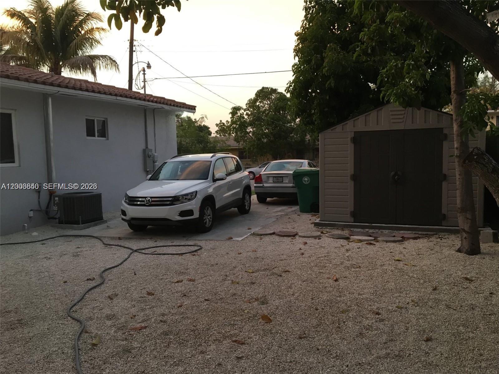 1380 Southwest 11th Street, Unit 1 Miami, FL 33135 - Photo 15 of 20 a view of a car parked in a yard