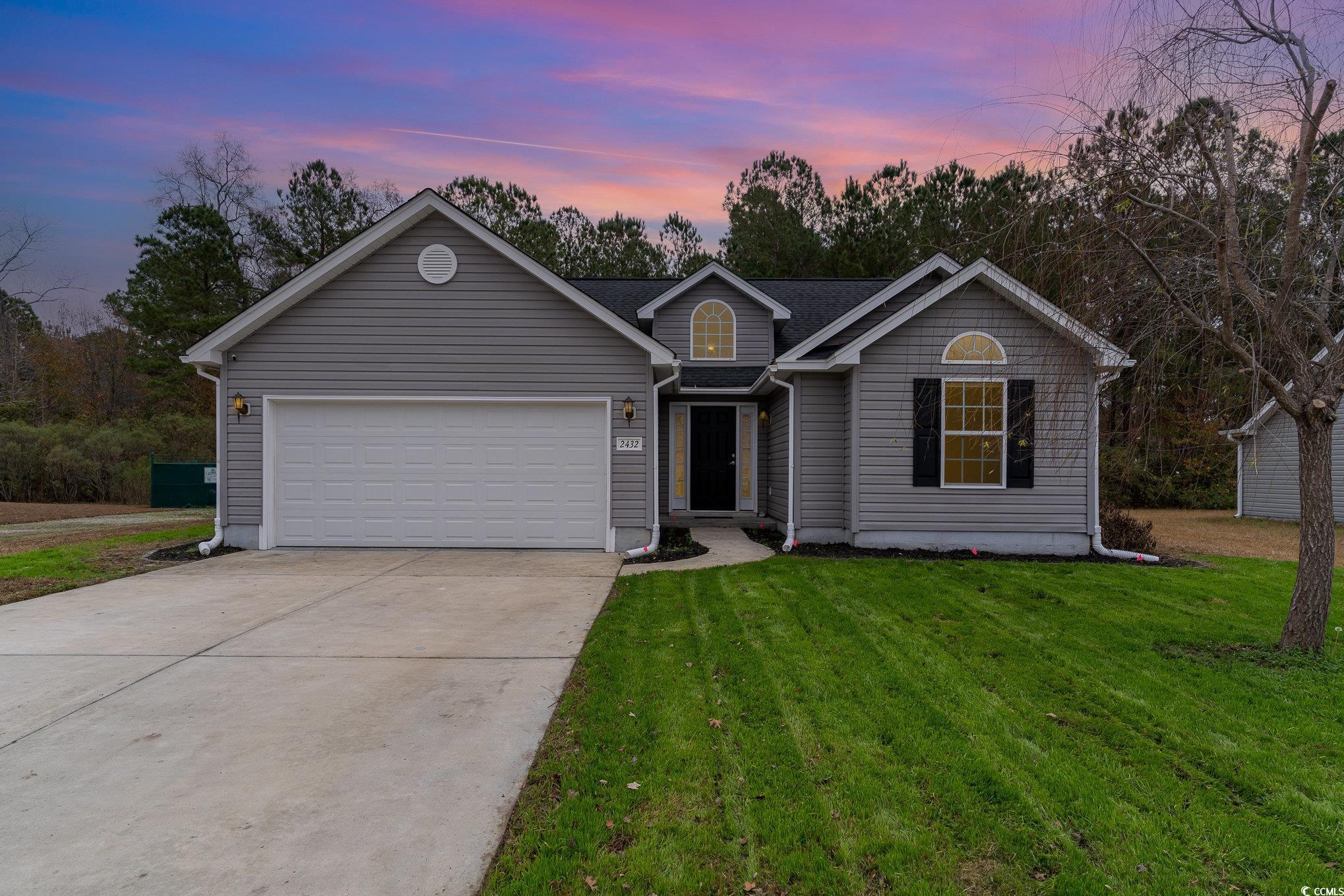 2432 Summerhaven Loop Conway, SC 29527 - Photo 1 of 40 Ranch-style house featuring a lawn and a garage