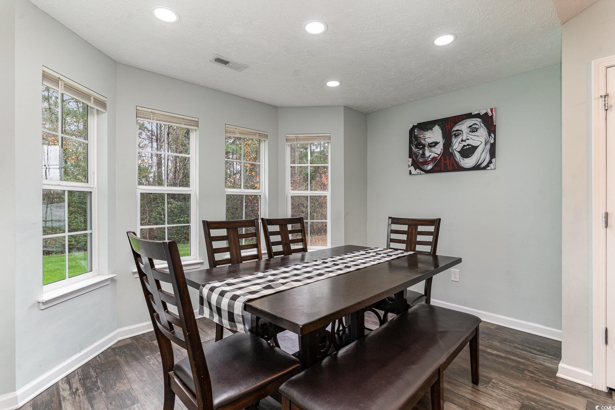 2432 Summerhaven Loop Conway, SC 29527 - Photo 11 of 40 Dining area with a textured ceiling and dark wood-