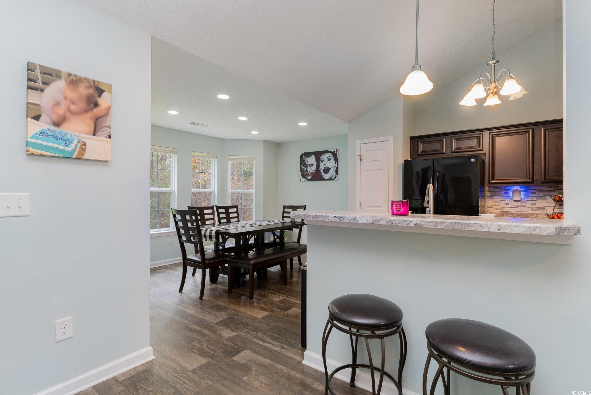 2432 Summerhaven Loop Conway, SC 29527 - Photo 12 of 40 Kitchen with a kitchen bar, tasteful backsplash, b