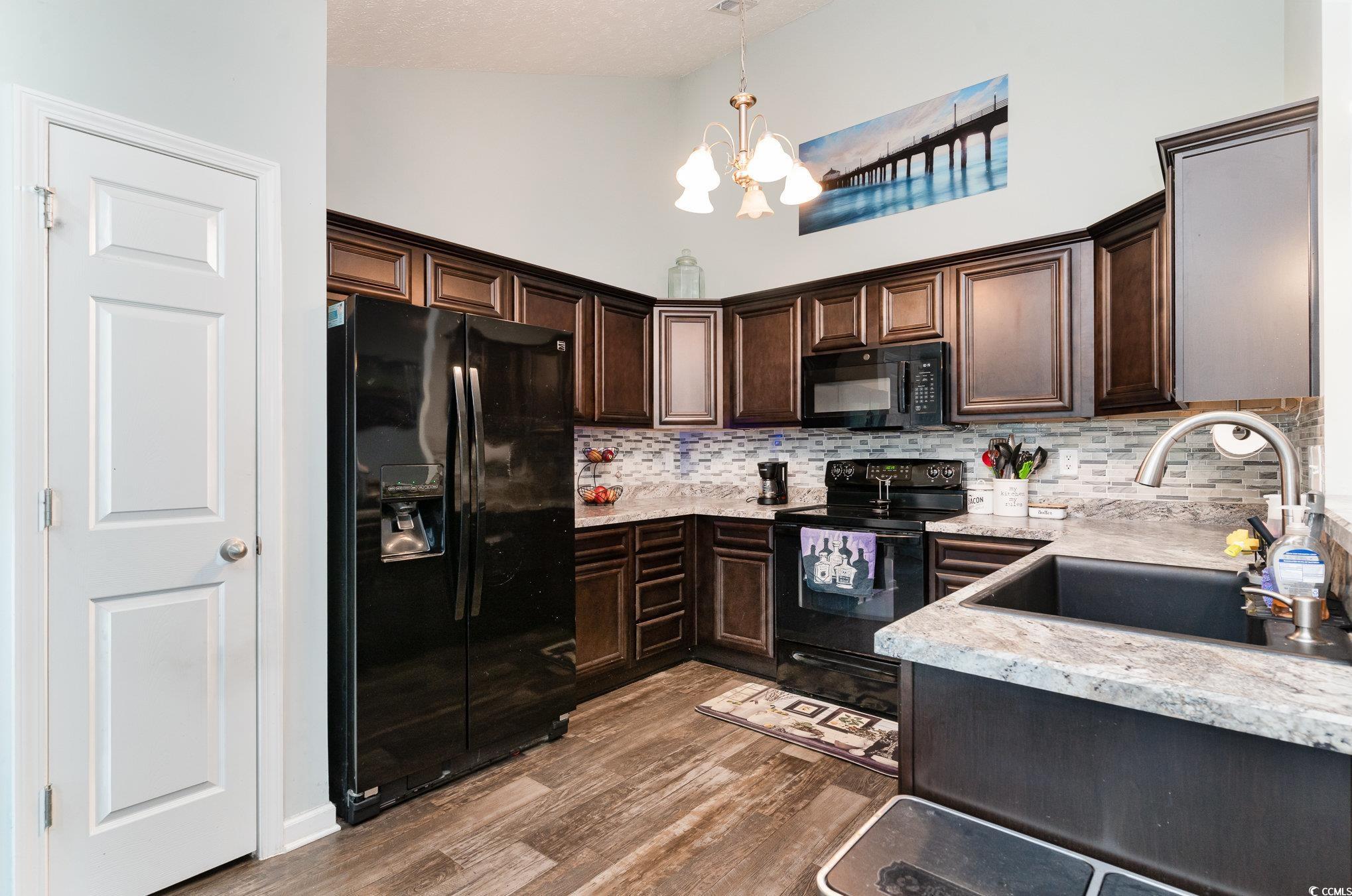 2432 Summerhaven Loop Conway, SC 29527 - Photo 14 of 40 Kitchen featuring black appliances, dark brown cab