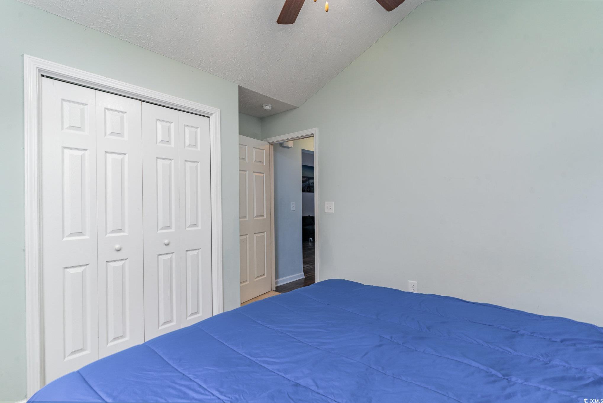 2432 Summerhaven Loop Conway, SC 29527 - Photo 23 of 40 Unfurnished bedroom with ceiling fan, a closet, an