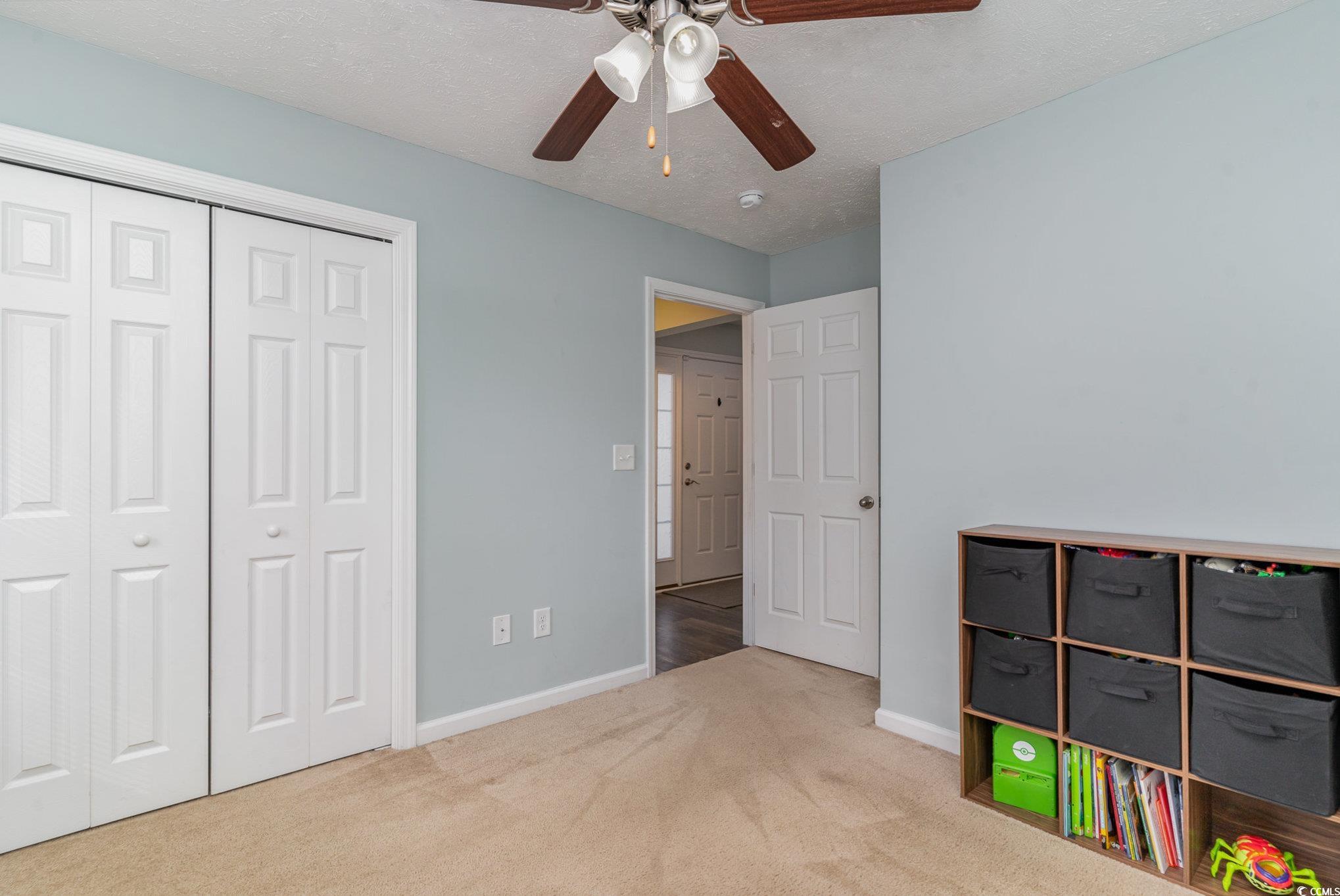 2432 Summerhaven Loop Conway, SC 29527 - Photo 25 of 40 Rec room with ceiling fan, light colored carpet, a