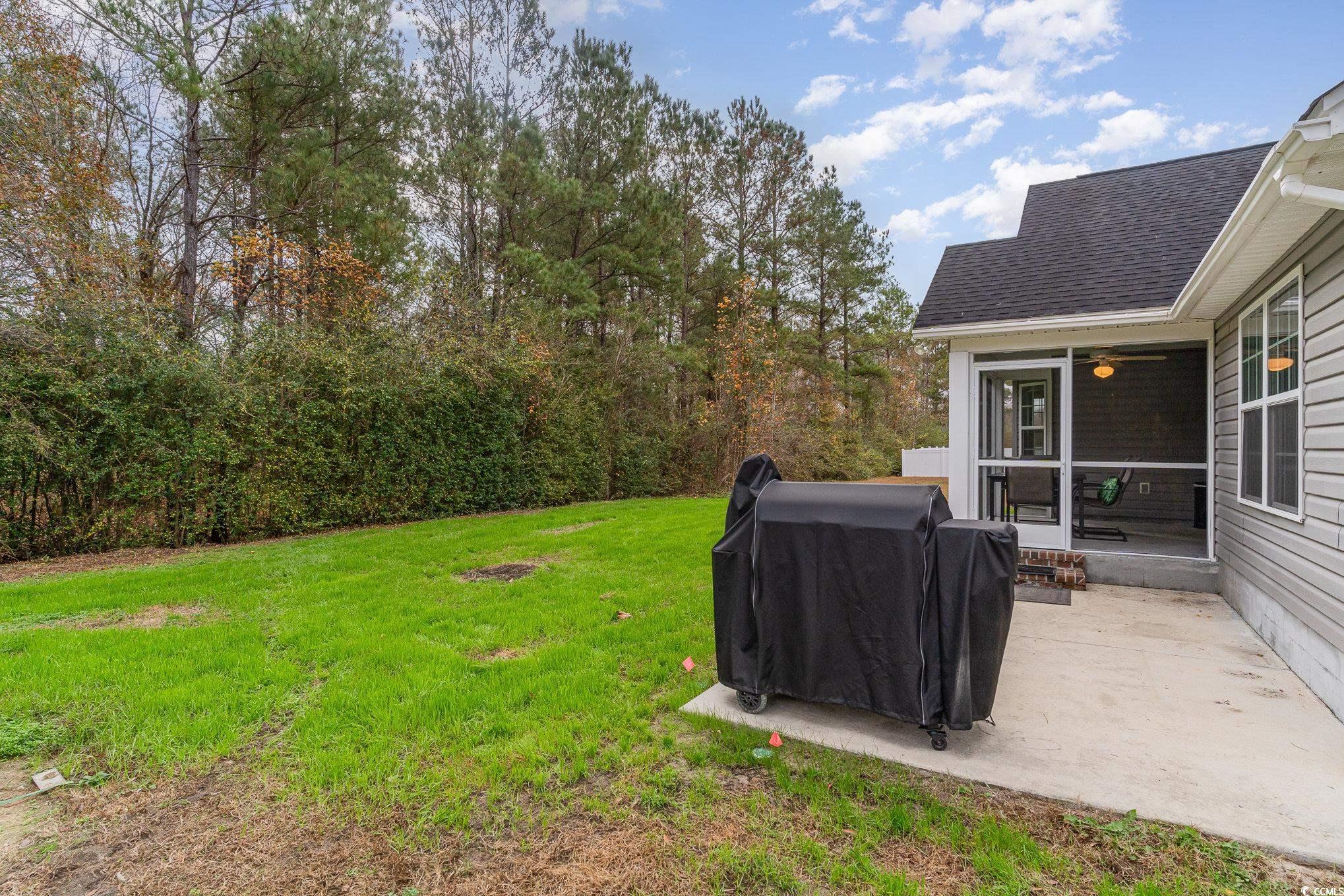 2432 Summerhaven Loop Conway, SC 29527 - Photo 30 of 40 View of yard featuring a patio
