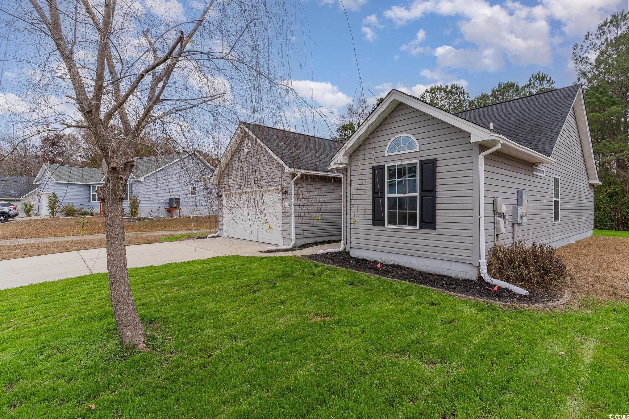 2432 Summerhaven Loop Conway, SC 29527 - Photo 3 of 40 View of front of home featuring a front yard and a